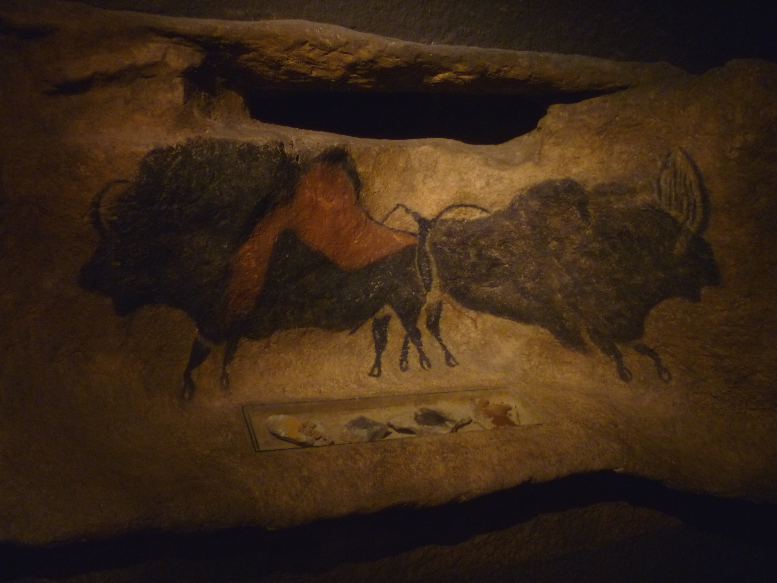 Prehistoric cave paintings on the walls of the Lascaux cave in France, showing horses painted approximately 17,000 years ago.